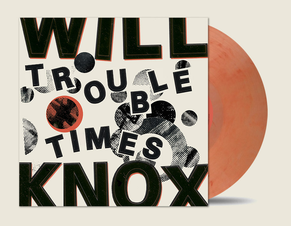 Vinyl record with a cover featuring stylized text and a red disc.