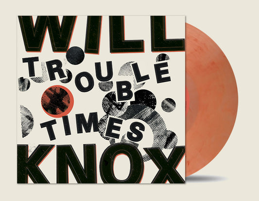 Vinyl record with a cover featuring stylized text and a red disc.